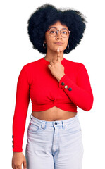 Sticker - Young african american girl wearing casual clothes and glasses thinking concentrated about doubt with finger on chin and looking up wondering