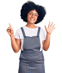 Sticker - Young african american girl wearing casual clothes showing and pointing up with fingers number six while smiling confident and happy.