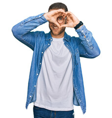 Canvas Print - Young caucasian man wearing casual clothes doing heart shape with hand and fingers smiling looking through sign