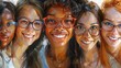 A group of women wearing glasses are happily smiling together