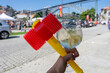 colorful plastic hammer with a porto tonic cocktail in Porto Portugal at sao joao festival saint john's day