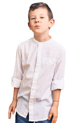 Poster - Cute blond kid wearing elegant shirt looking at the camera blowing a kiss on air being lovely and sexy. love expression.