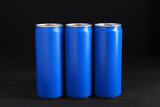 Fototapeta Kuchnia - Energy drinks in blue cans on black wooden table