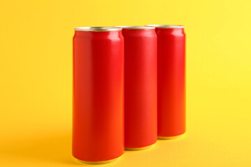 Sticker - Energy drinks in red cans on yellow background