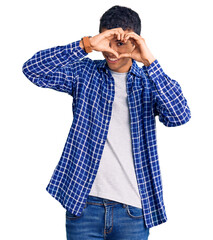 Poster - Young african amercian man wearing casual clothes doing heart shape with hand and fingers smiling looking through sign