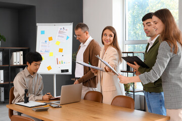 Sticker - Group of business people working at table in office