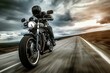 Speeding motorcyclist on classic bike cruising on highway with overcast skies