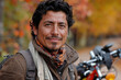 © ADDICTIVE STOCK - Autumn portrait of a smiling man with motorcycle. Generative AI image