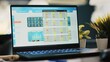 Notebook screen with stock market data collected in office to develop trading strategies and algorithms, close up shot. Laptop on desk in company workplace showing trading platform