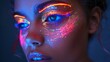 Fashion model woman in neon light, portrait of beautiful model with fluorescent make-up, Art design of disco dancers posing in UV, colorful make-up. Isolated on black background.