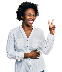 Wall Mural - African american woman with afro hair wearing casual white t shirt smiling with happy face winking at the camera doing victory sign. number two.