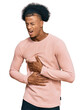 African american man with afro hair wearing casual clothes with hand on stomach because nausea, painful disease feeling unwell. ache concept.