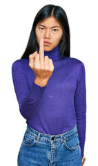 Sticker - Beautiful young asian woman wearing casual clothes showing middle finger, impolite and rude fuck off expression