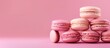 Stacked pink macarons resting on top of one another creating a delightful sweet treat