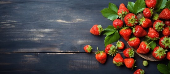 Poster - Wooden spoon with fresh strawberries arranged on a table