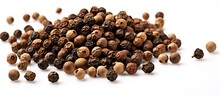 A Close-up View Of Numerous Black Peppercorn Seeds Neatly Stacked On A Clean White Background