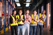 © Wosunan - Portrait of group employees in the warehouse with arms crossed