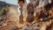 Close-up capture of the determination on a dirt route, trail running shoes forging ahead on a mountain trail