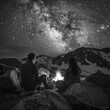 A couple of people sitting on rocks under a starry sky. Generative AI.