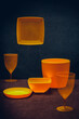 A set of yellow plastic dishes