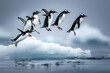 Penguins jumping off an ice floe into the ocean