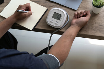 man checking blood pressure Health check blood pressure and heart rate at home