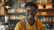 Happy young african american male cafe owner standing with smiling at the camera in front of his shop interior, in the style of a portrait shot. generative AI