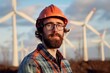 Male engineer standing a top of windmill or Wind generator background, alternative energy concept