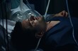 Hospital patient lying in bed, receiving medical procedures and intravenous drips