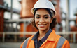 Portrait of a smiling female engineer at an oil refinery.