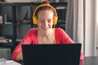 Millennial student sit at desk study on laptop