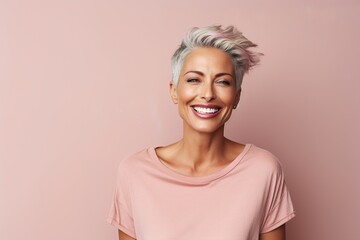 Wall Mural - A woman with a pink shirt and pink hair is smiling