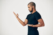 © peopleimages.com - Tai chi, exercise and man in martial arts training or calm movement with hands on white background. Healthy, workout and person with skill in self defence technique or practice karate in gym