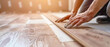 © Stockpics - Worker installing laminate wooden floor close up. Generative ai design concept art.