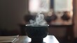 The steam rising from a cup of herbal tea