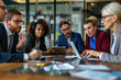 © ASDF - A diverse group of business people gathered around an office table