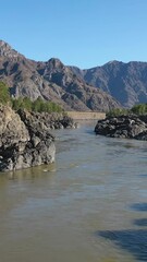 Wall Mural - Vertical lowflying video from drone over Teldykpen rapids on Altai river Katun near Oroktoi bridge