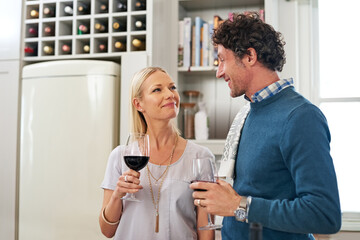 Sticker - Couple, alcohol and drinking to celebrate love in home, marriage and relax on anniversary. People, glasses and red wine for milestone in relationship, romance and care in connection or bonding