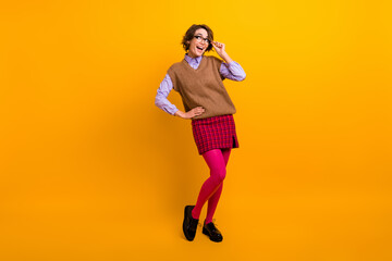 Wall Mural - Photo portrait of attractive young woman look excited empty space dressed retro office clothes isolated on yellow color background