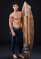 young surfer and retro board in studio and dark with body, stomach and strong or healthy. male wave 