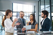 © peopleimages.com - Communication, people and meeting in office with tablet for business report or online growth with information sharing. Manager, employees and conversation for feedback, corporate and career in sales.