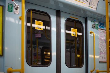 Italia, Milano 10.04.2024: An empty train waits at the San Donato metro station in Milan. Doors in a subway car. Public transport concept