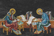 Christian traditional image of Matthew Levi the Apostle and Luke the Evangelist. Religious illustration on black stone wall background in Byzantine style