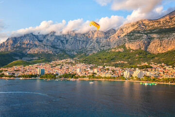 Wall Mural - Beautiful aerial view of the town of Makarska, Dalmatia, Croatia. Summer landscape with yachts, sea, architecture and rocks, famous tourist destination at Adriatic seacoast, travel background