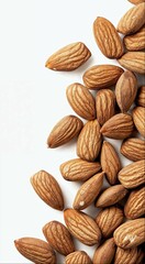 Wall Mural - almonds are scattered on the ground and one is peeled