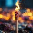 An AI illustration of a burning stick sits on a dark ground in the foreground
