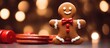 Gingerbread man with festive red bow close up