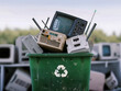 Waste bin full of electronics, e waste and recycling concept