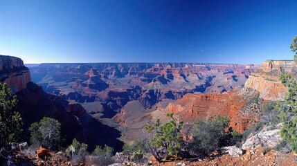 The iconic Grand Canyon stretches wide and deep. Towering cliffs carved by the hands of time It is a miracle of nature's art.