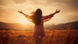 © Damerfie - A serene silhouette of a woman with arms raised in a field at sunset, evoking feelings of happiness and freedom